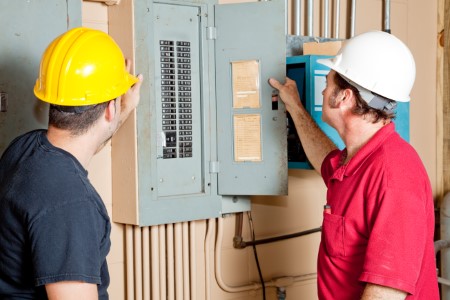 Electrical panel two technicians